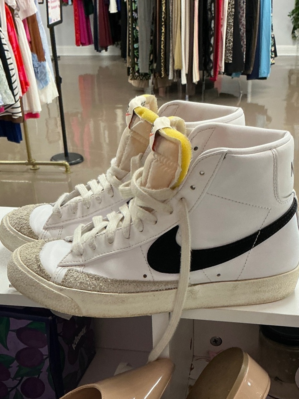 Nike Women's White High-Top Sneakers with Black Swoosh and Yellow Tongue